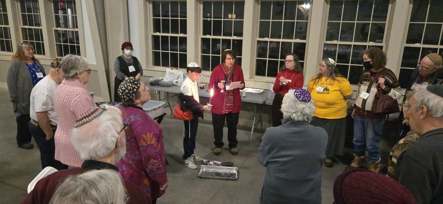 Havdalah with a child holding the candle
